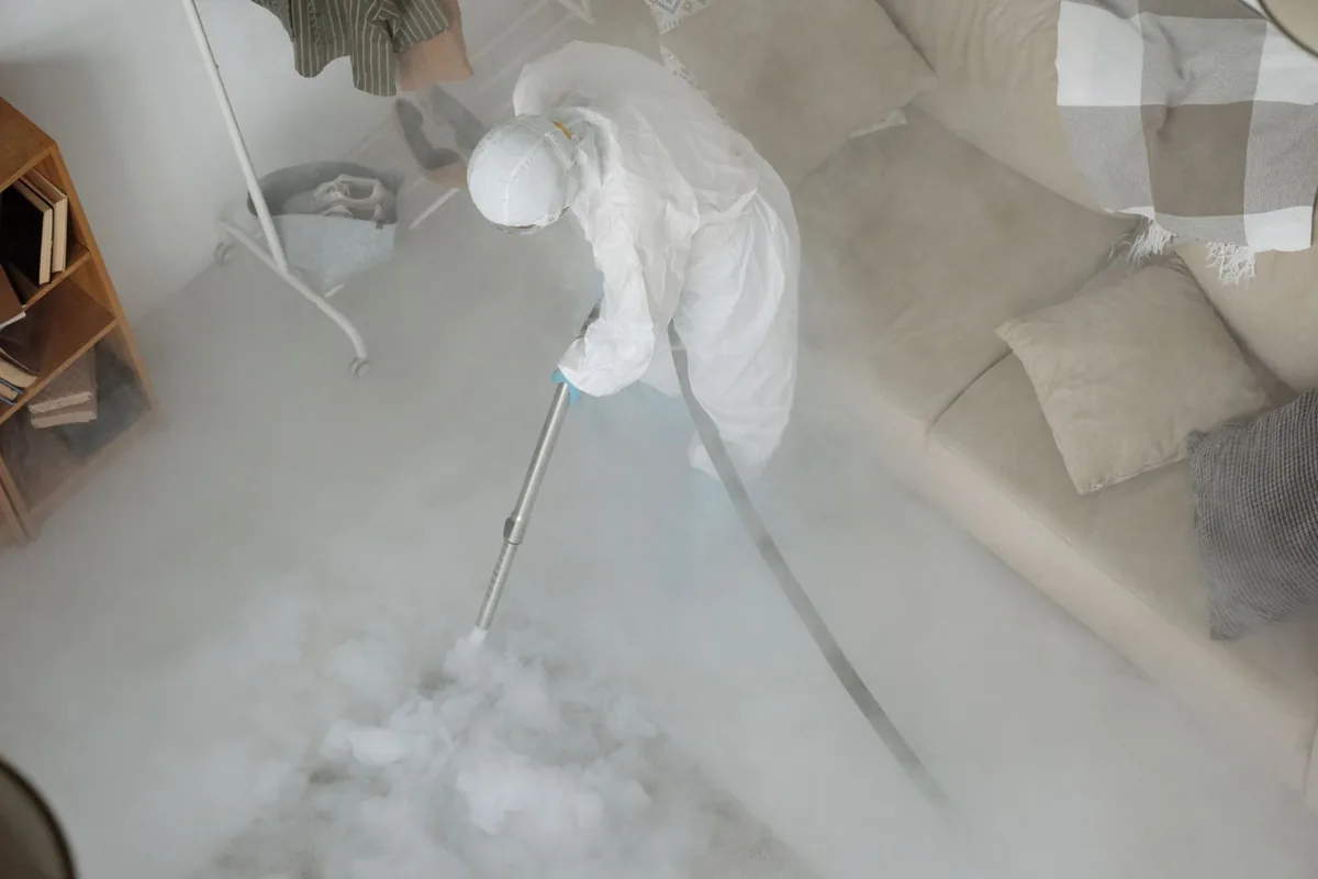 Biohazard cleanup technician in protective equipment, Milltown, NJ